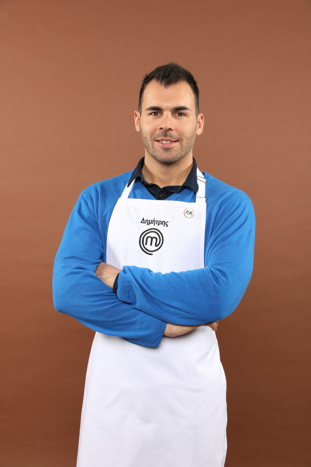 Ο Δημήτρης Χέλμουτ Μπέλλος με ποδιά του MasterChef 4