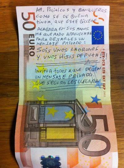 Οι οργισμένοι Ισπανοί βρίζουν πολιτικούς και τραπεζίτες πάνω σε χαρτονομίσματα [εικόνες]  | iefimerida.gr 0