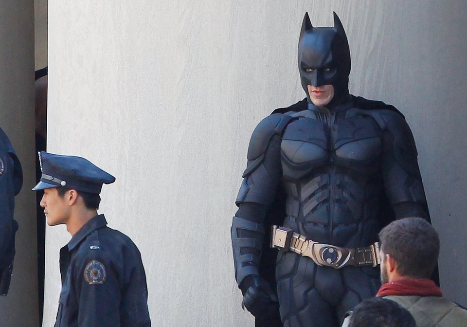 Christian Bale stands in between scenes during the filming of the Batman: Dark Knight Rises movie (Photo by Jared Wickerham/Getty Images)