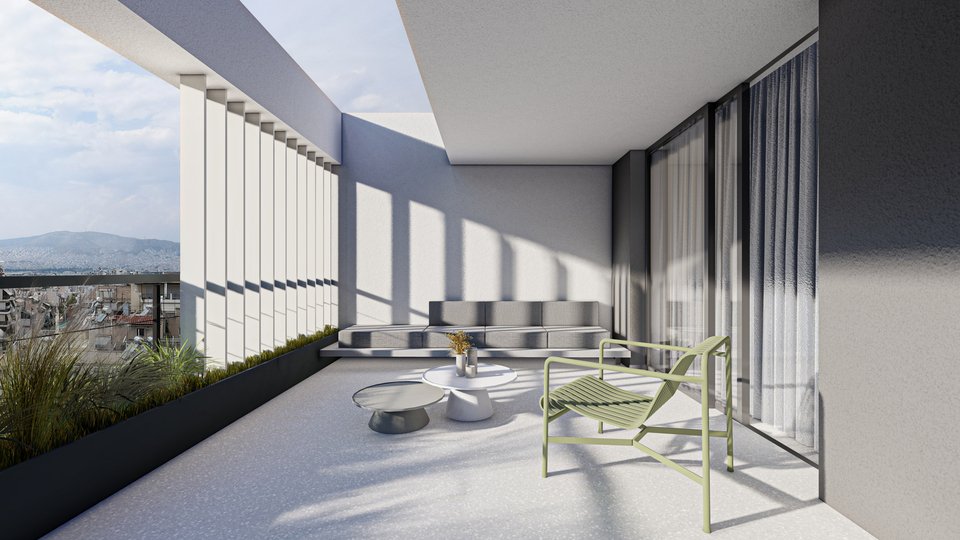 Το υπαίθριο lounge σε μία από τις ευρύχωρες βεράντες της πολυκατοικίας.