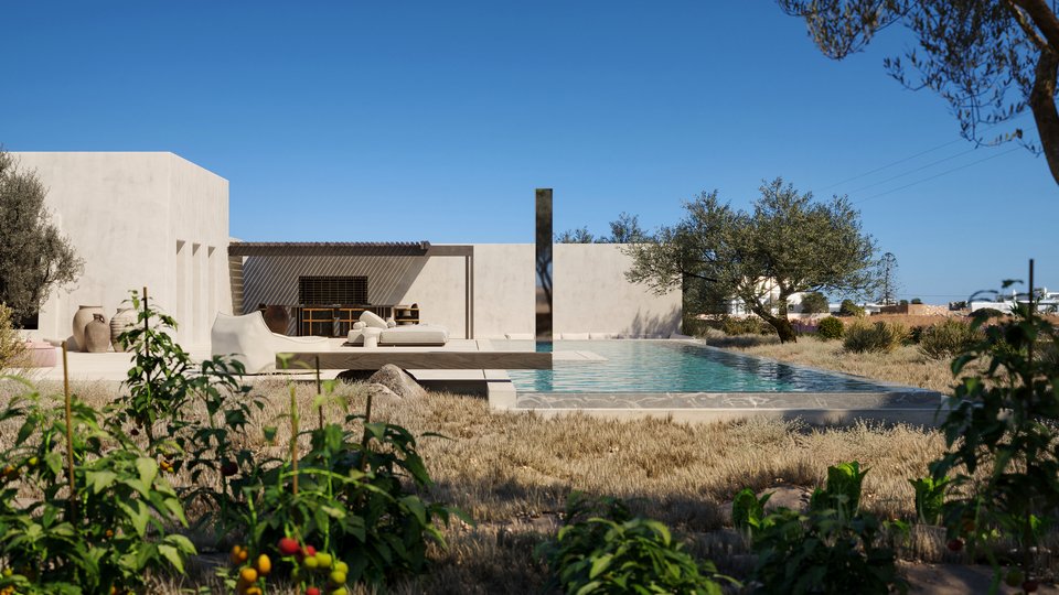 Η Τέχνη συνομιλεί με το design: Ένας στύλος από ματ inox δεσπόζει στην πισίνα.