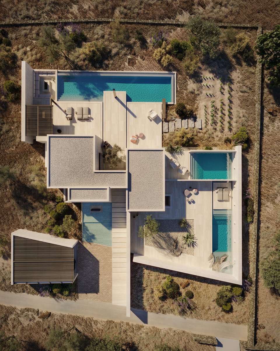 Άποψη της κατοικίας με τις τέσσερις πισίνες γύρω από τα δύο οικήματα