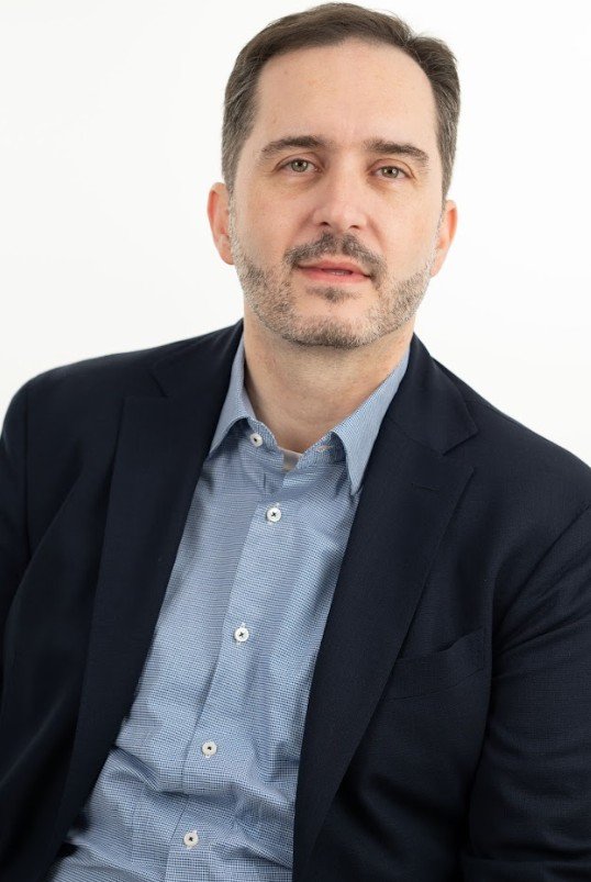 Ο Αθανάσιος Θεοχάρης είναι Εθνικός Συντονιστής για την Αντιμετώπιση των Εξαρτήσεων στην Ελλάδα, Πρόεδρος του ΔΣ του Εθνικού Οργανισμού Πρόληψης και Αντιμετώπισης Εξαρτήσεων (ΕΟΠΑΕ), Εκπρόσωπος της Ελλάδας στο Γραφείο των Ηνωμένων Εθνών για τα Ναρκωτικά και το Έγκλημα (UNODC), στην Οριζόντια Ομάδα για τα Ναρκωτικά του Ευρωπαϊκού Συμβουλίου (HDG), Μόνιμος Αντιπρόσωπος την Ομάδα Pompidou στο Στρασβούργο για τα Ναρκωτικά και τις Εξαρτήσεις. Είναι επίσης Μέλος του Διοικητικού Συμβουλίου του Οργανισμού της ΕΕ για τα Ναρκωτικά (EUDA), Μέλος της Επιτροπής Εμπειρογνωμόνων Δημόσιας Υγείας και Μέλος του Κεντρικού Συμβουλίου Υγείας στην Ελλάδα. 