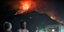 Κάτοικοι στο Λουτράκι παρακολουθούν τις φλόγες τη νύχτα