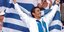 Ο Νίκος Κακλαμανάκης με την ελληνική σημαία