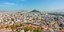 Πανοραμική θέα της Αθήνας με κατοικίες και τον Λυκαβηττό 