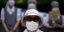 Γυναίκα με μάσκα στην Ασία