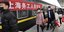 Κινέζοι με μάσκες σε σταθμό τρένου