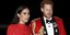 Η Μέγκαν Μαρκλ με κόκκινο φόρεμα και ο πρίγκιπας Χάρι