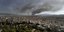 Ένα μαύρο σύννεφο καπνού από την πυρκαγιά ορατό από πολλές περιοχές της Αθήνας λόγω της πυρκαγιάς 