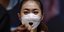 Γυναίκα στην Κίνα με μάσκα