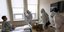 Ειδικοί με στολές και μάσκες σε νοσοκομείο αναφοράς κορωνοϊού στη Ρωσία