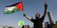 Παλαιστίνιος με σημαία της χώρας του