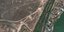 Αυτή η δορυφορική εικόνα που παρέχεται από την Maxar Technologies δείχνει την ανάπτυξη πυροβολικού πεδίου δυτικά του αεροδρομίου Antonov στο Hostomel της Ουκρανίας κατά τη διάρκεια της ρωσικής εισβολής τη Δευτέρα 21 Μαρτίου 2022. (Δορυφορική εικόνα ©2022 Maxar Technologies via AP)
