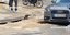 Προβλήματα από τη νεροποντή: Αυτοκίνητο έπεσε σε λακκούβα στο Παγκράτι