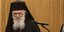 Ο Αρχιεπίσκοπος Ιερώνυμος πίσω από ένα μικρόφωνο