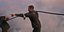 A volunteer holds a hose