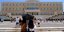 People walks in the streets during a hot day in central Athens