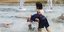 Children jumped into a fountain to beat the heat