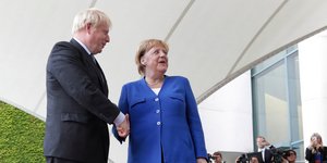 H Γερμανίδα καγκελάριος Μέρκελ και ο Βρετανός πρωθυπουργός Τζόνσον