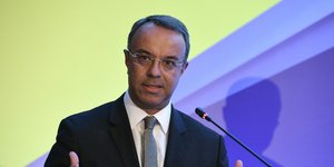 Ο Χρήστος Σταϊκούρας στο podium