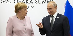 Ο Βλαντιμίρ Πούτιν με την Ανγκελα Μέρκελ