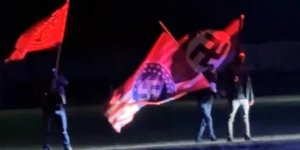 Μασκοφόροι με ναζιστικές σημαίες
