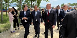 In the center, the Greek Minister of Environment and Energy, Stavros Papastavrou