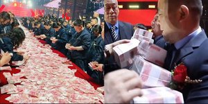 Εργαζόμενοι εταιρείας στην Κίνα σηκώνουν μετρητά που τους διανεμήθηκαν ως μπόνους 