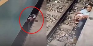 Ο πατέρας κάλυψε το μωρό του καθώς περνούσε τρένο από πάνω τους