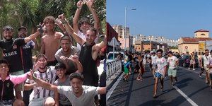 Παράτυποι μετανάστες πανηγυρίζουν μετά την είσοδό τους από το Μαρόκο στη Θέουτα 