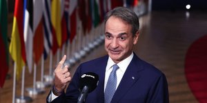 Greece's Prime Minister Kyriakos Mitsotakis speaks with the media at the end of the EU summit in Brussels, Friday, Oct. 16, 2026